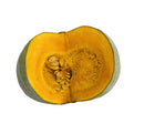 Half-cut pumpkin with seeds on a white background
